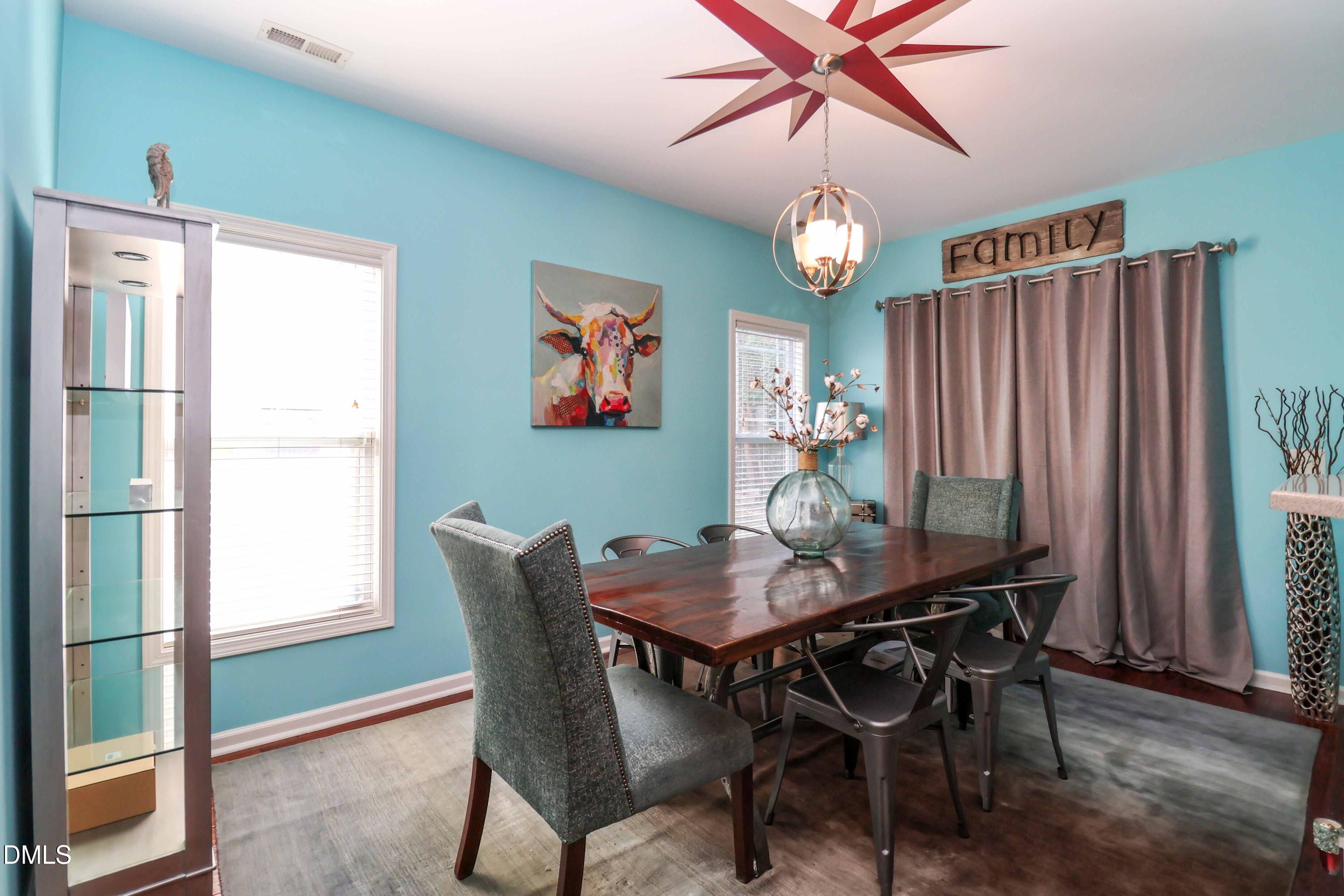 3152 Landing Falls Lane Raleigh, NC 27616 - Photo 7 of 29 a view of a dining room with furniture window and wooden floor