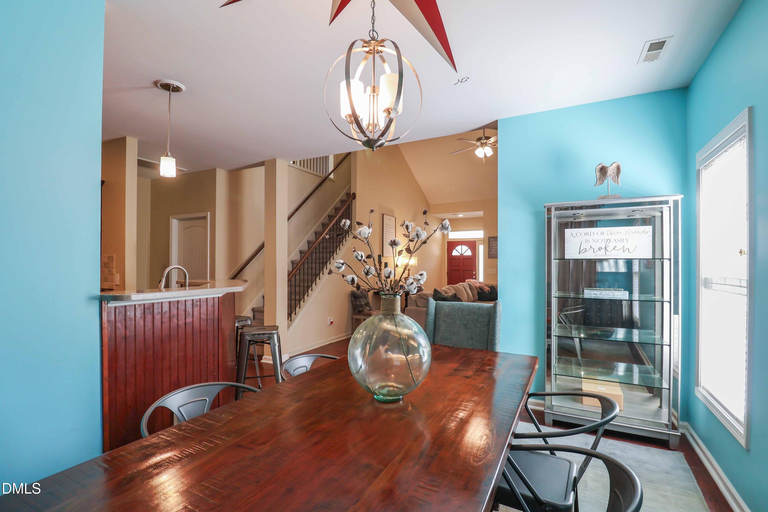 3152 Landing Falls Lane Raleigh, NC 27616 - Photo 8 of 29 a view of a livingroom with furniture windows and wooden floor