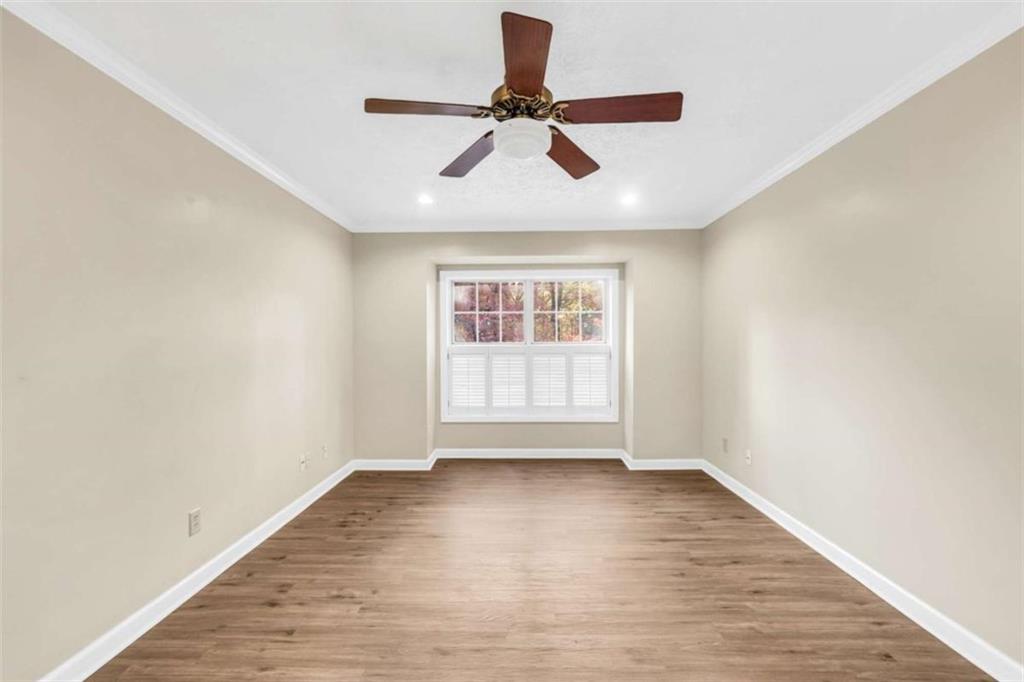 1482 North Crossing Circle Atlanta, GA 30329 - Photo 17 of 34 wooden floor in an empty room with a window