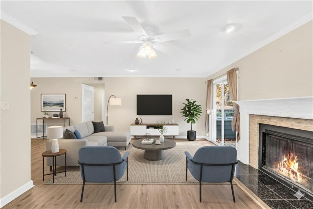 1482 North Crossing Circle Atlanta, GA 30329 - Photo 4 of 34 a living room with furniture a fireplace and a flat screen tv