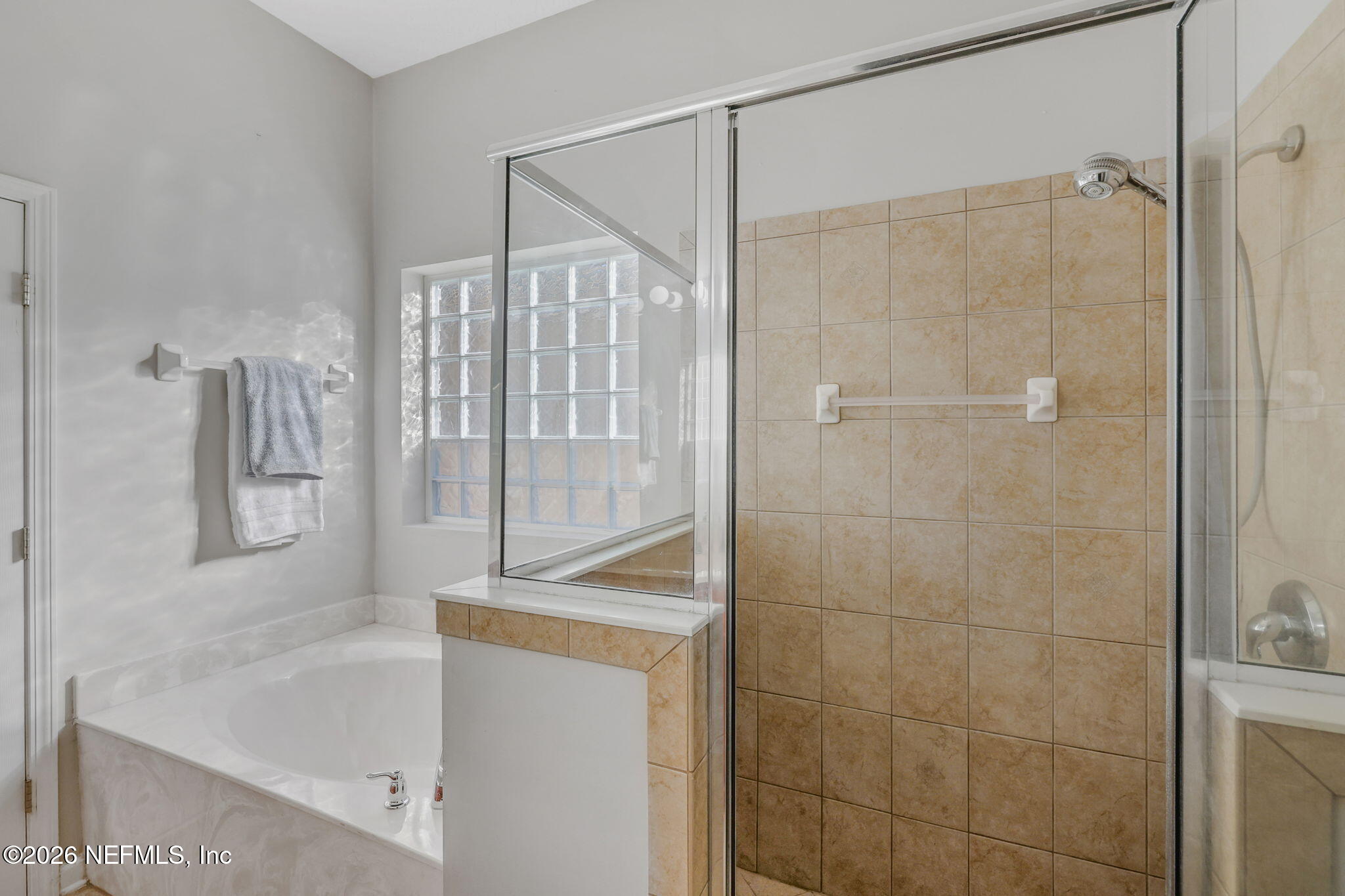 511 Roserush Lane Jacksonville, FL 32225 - Photo 26 of 61 a bathroom with a bathtub and a shower