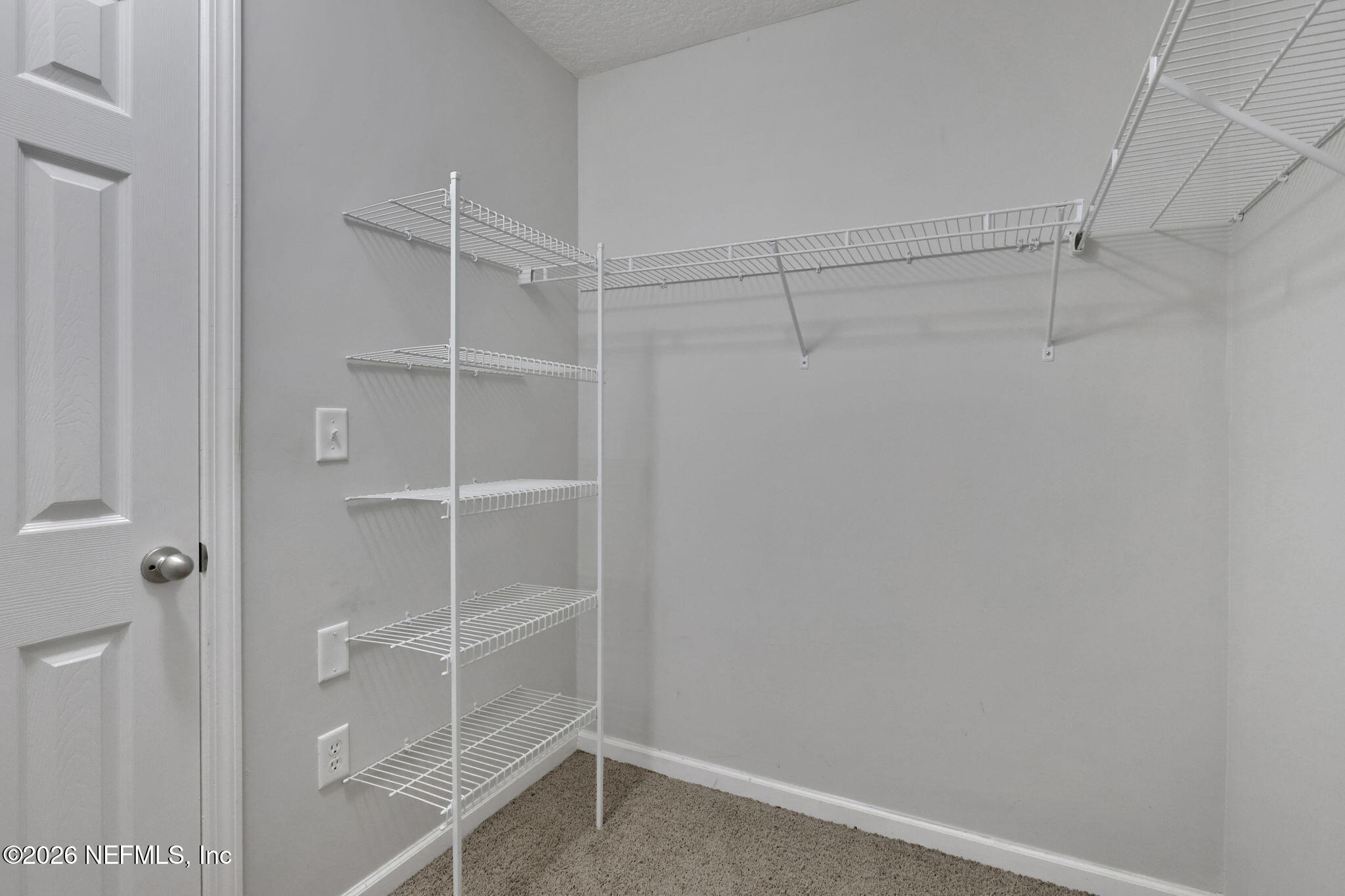511 Roserush Lane Jacksonville, FL 32225 - Photo 27 of 61 a view of walk in closet with empty racks