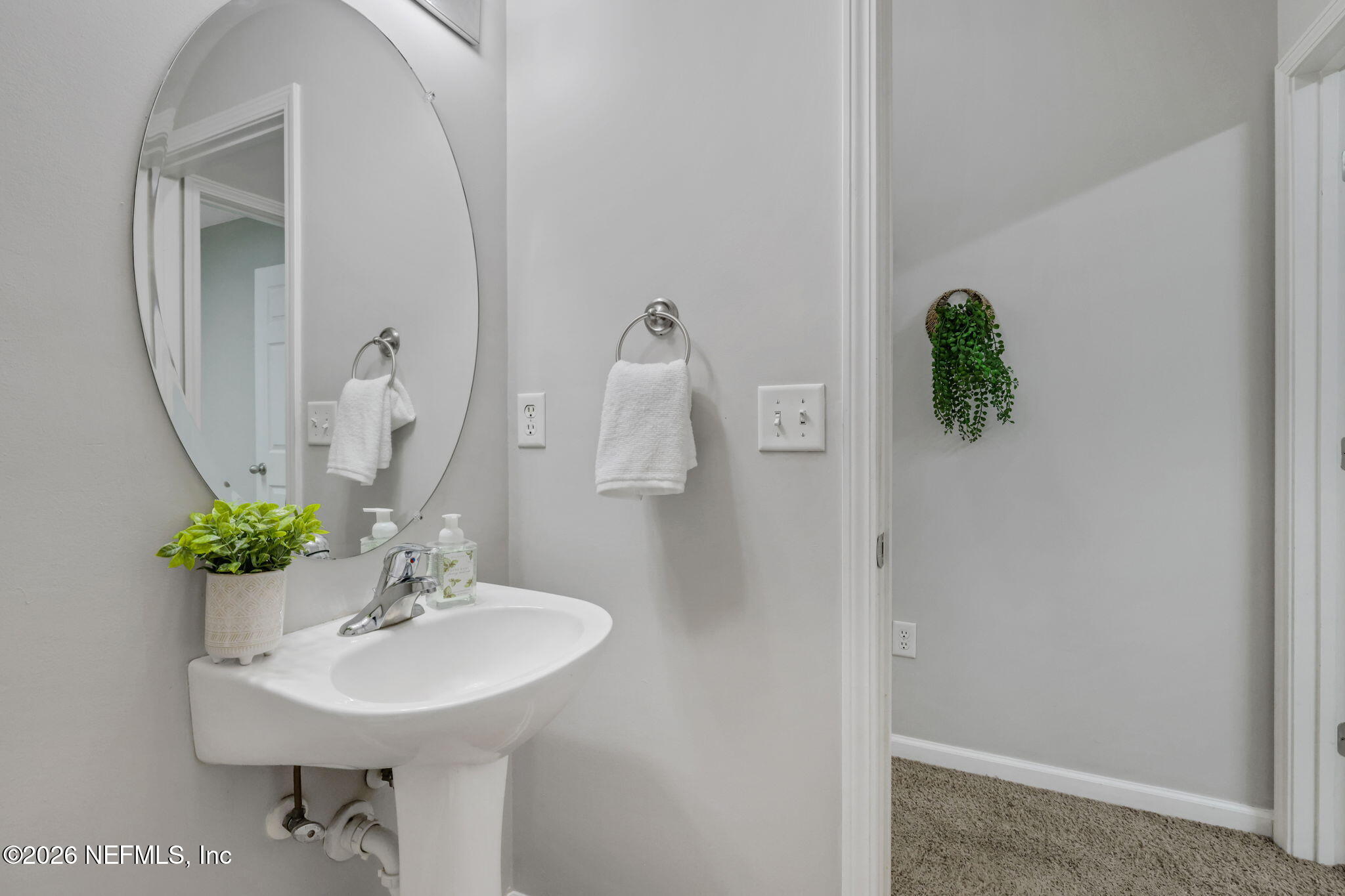 511 Roserush Lane Jacksonville, FL 32225 - Photo 34 of 61 a bathroom with a sink and a mirror