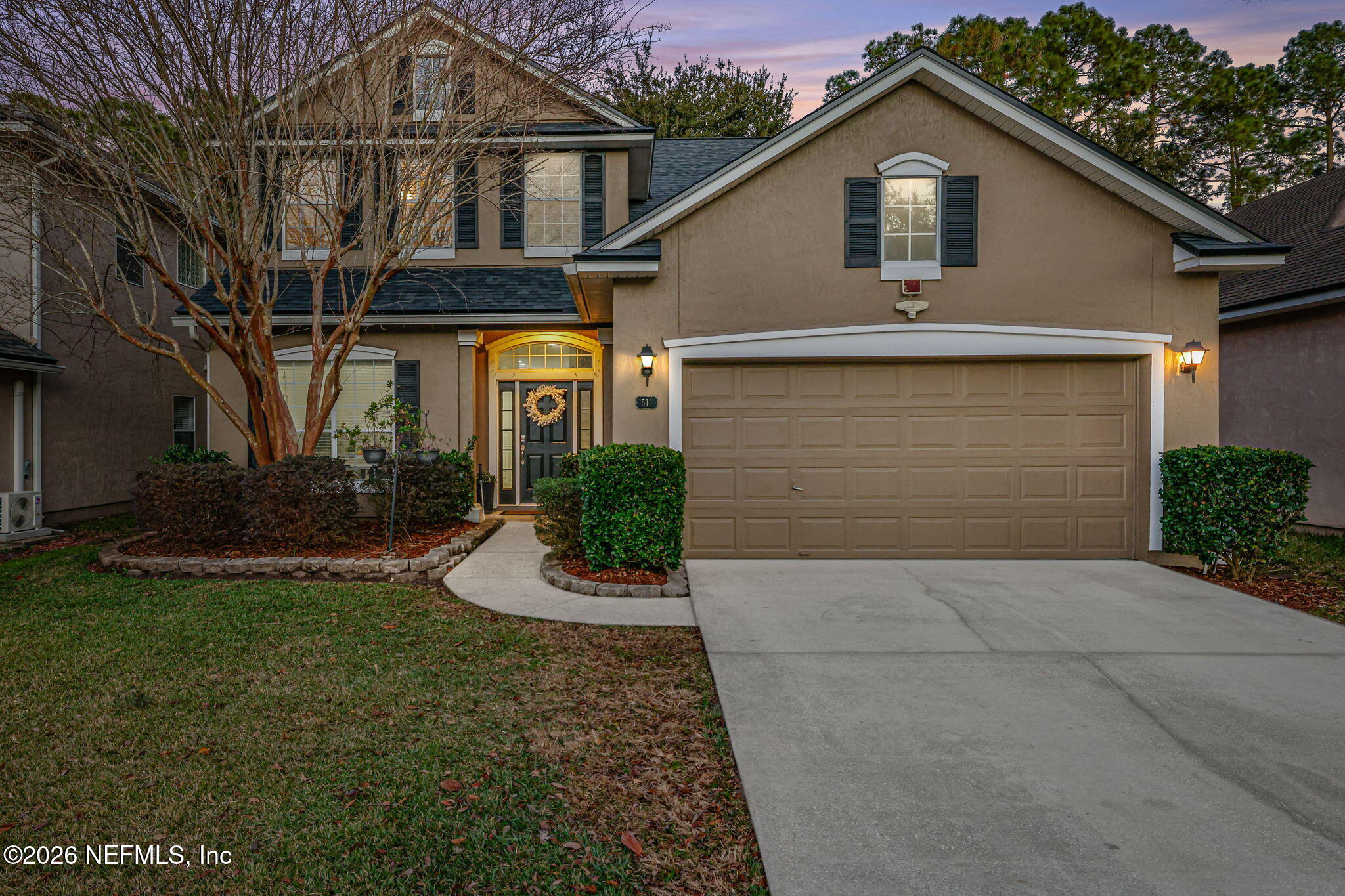 511 Roserush Lane Jacksonville, FL 32225 - Photo 52 of 61 a front view of a house with a yard and garage