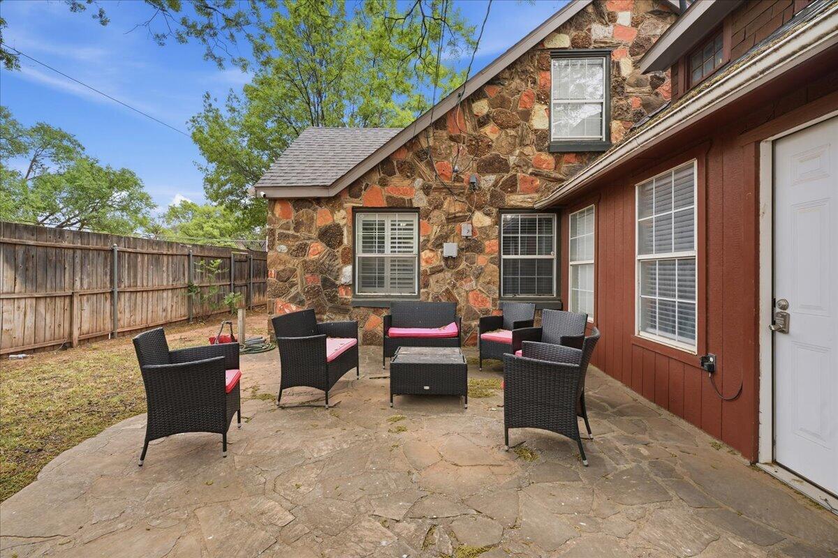 2702 20th Street Lubbock, TX 79410 - Photo 30 of 34 a backyard of a house with outdoor seating