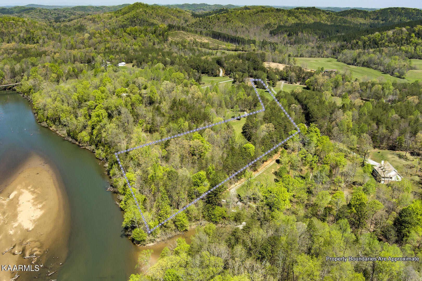 3320 Ballplay Road Tellico Plains, TN 37385 - Photo 20 of 21 a view of a lake with a mountain