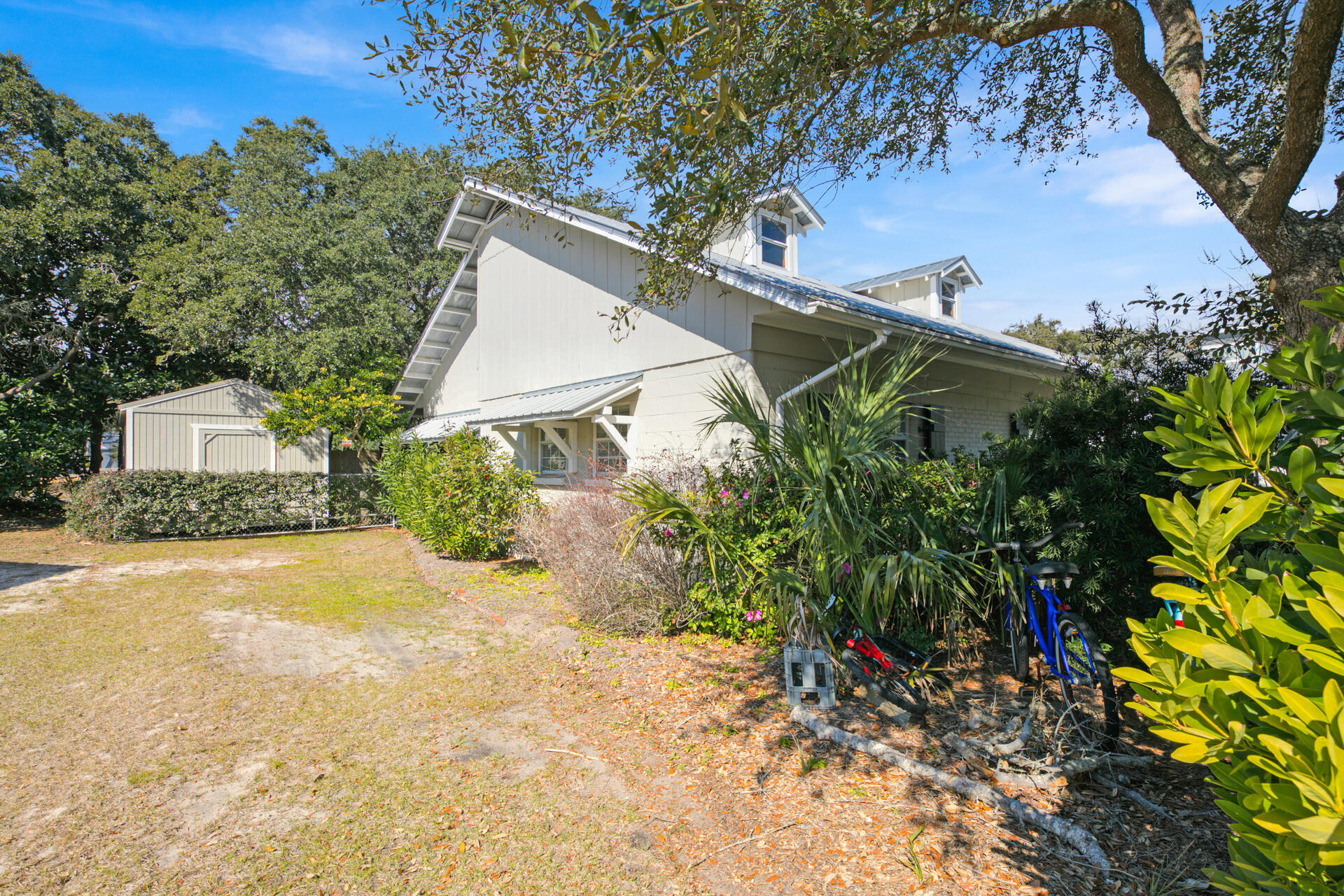 Undisclosed Address Santa Rosa Beach, FL 32459 - Photo 12 of 30 a view of a house with a yard and plant