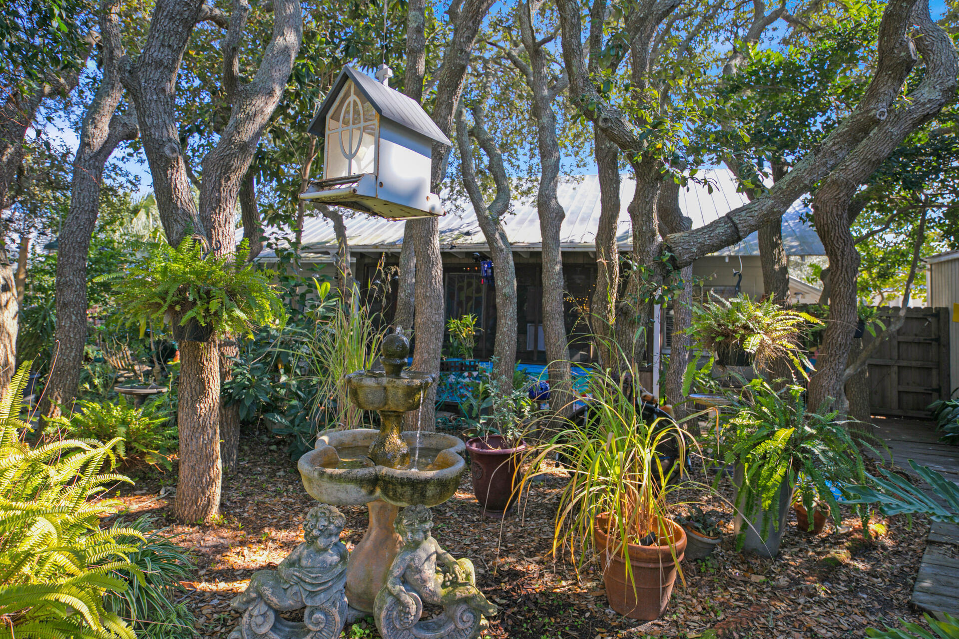Undisclosed Address Santa Rosa Beach, FL 32459 - Photo 21 of 30 a view of a patio with table and chairs and potted plants