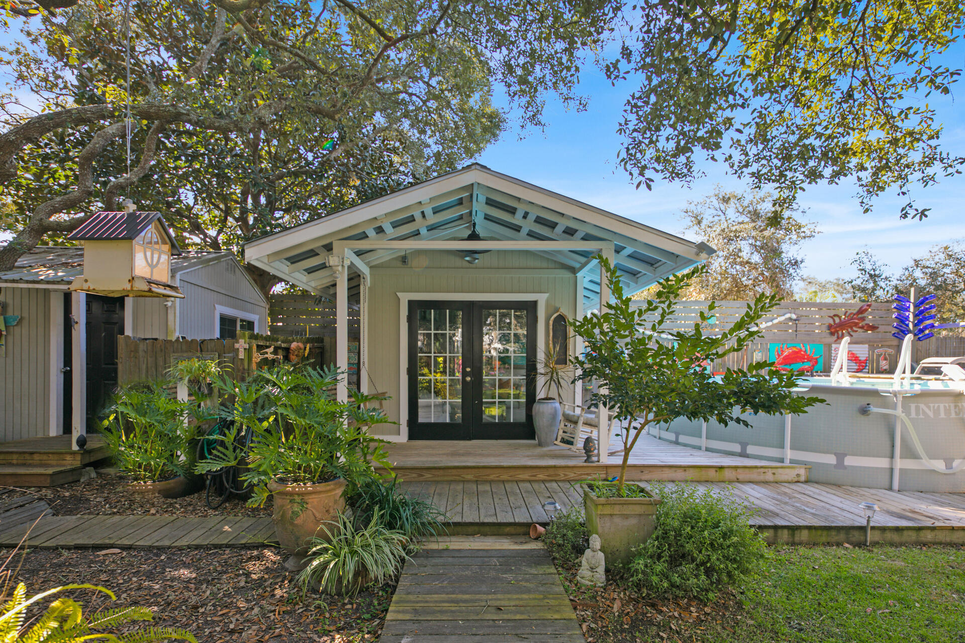 Undisclosed Address Santa Rosa Beach, FL 32459 - Photo 22 of 30 a front view of a house with garden