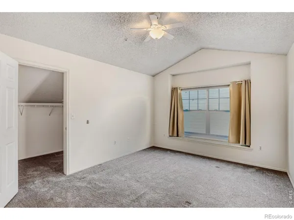 a view of empty room with fan