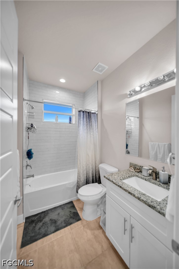 384 Neighborly Road LaBelle, FL 33935 - Photo 21 of 45 a bathroom with a granite countertop sink a toilet and shower