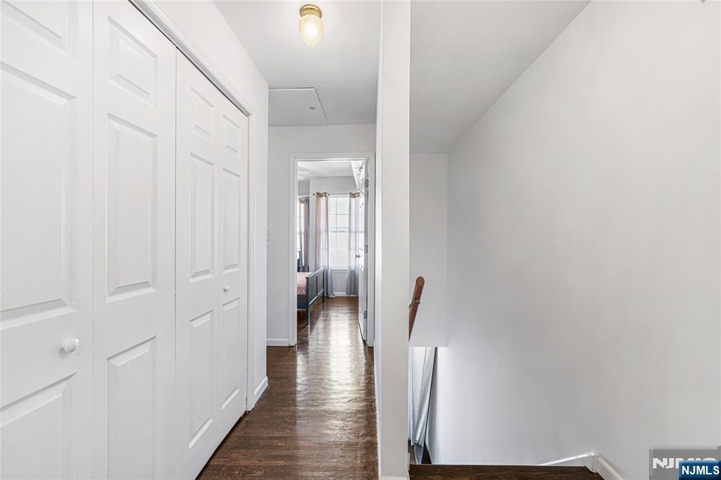 84 Union Street Newark, NJ 07105 - Photo 29 of 39 a view of a hallway with wooden floor and staircase