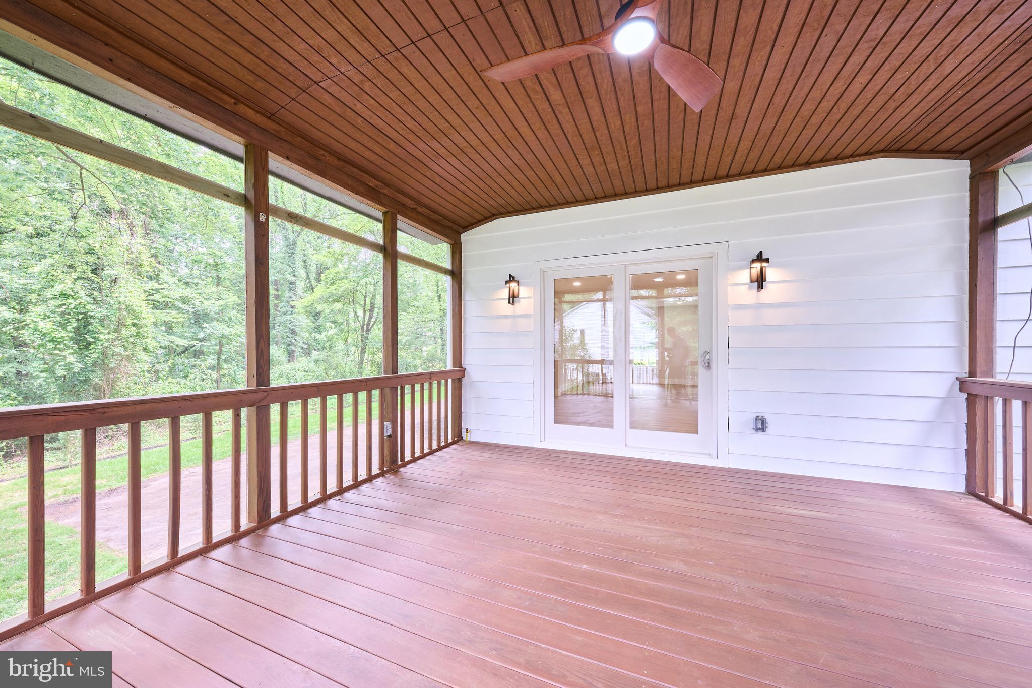 11318 Vale Road Oakton, VA 22124 - Photo 43 of 99 a view of an empty room with wooden floor and a window