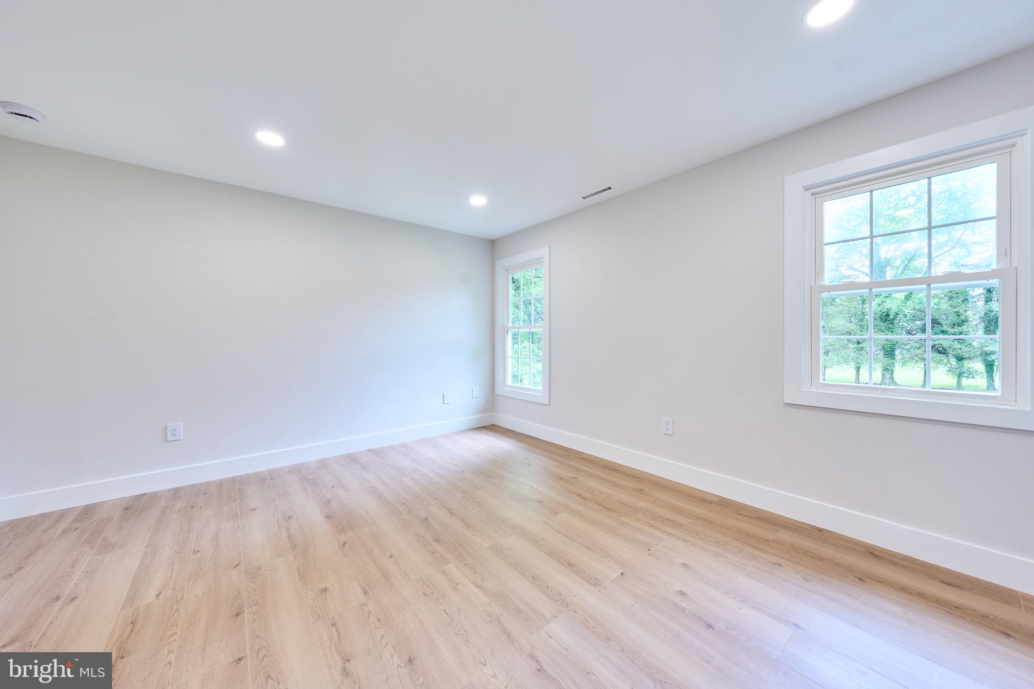 11318 Vale Road Oakton, VA 22124 - Photo 65 of 99 an empty room with wooden floor and windows