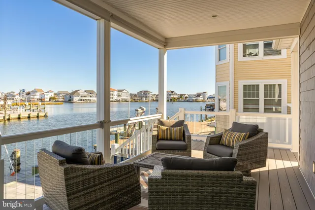 a balcony with furniture and city view