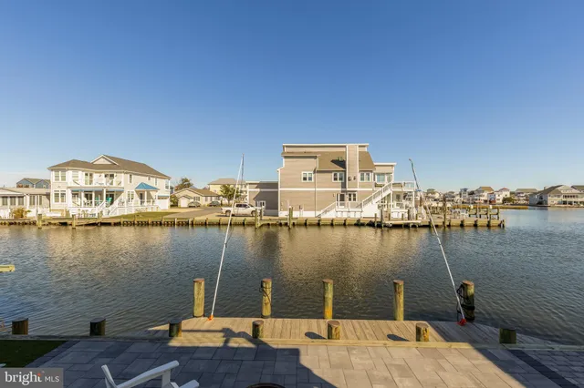 a view of a lake with boats and trees in the background
