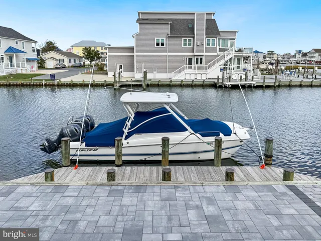 a view of a roof deck with table and chairs