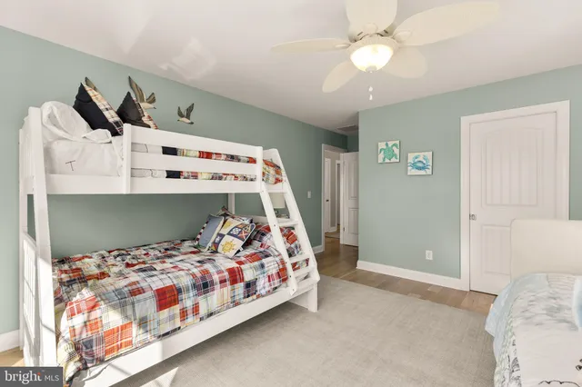 a bedroom with bed and a chandelier