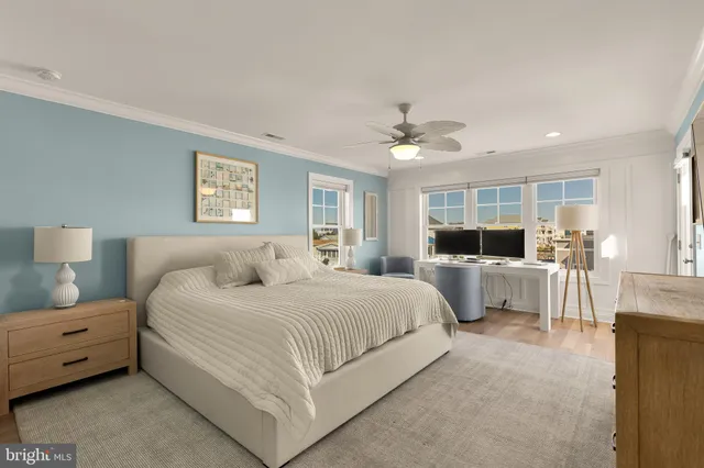 a bedroom with a bed a table and chair