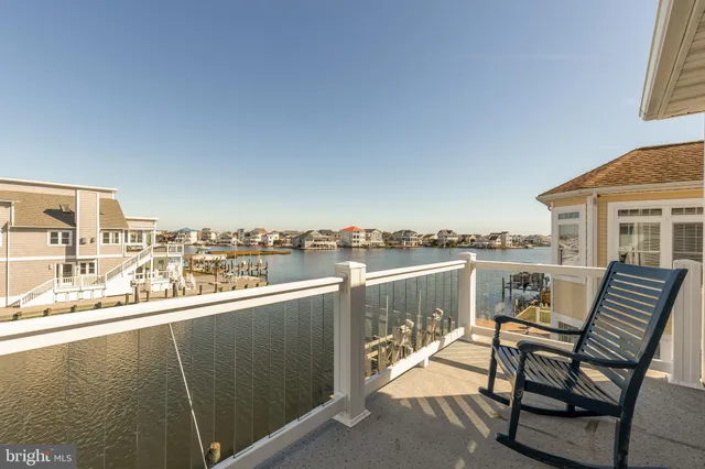a view of a balcony with two chairs and a table