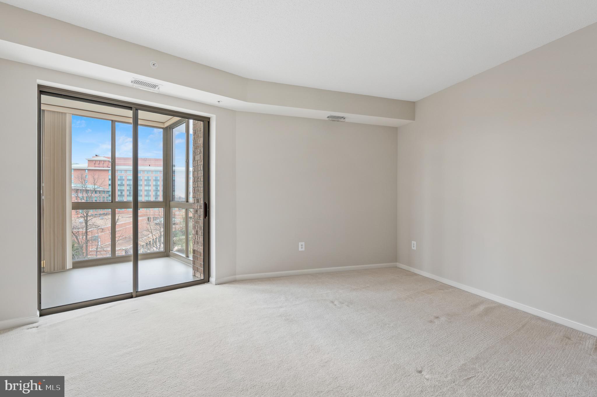 19355 Cypress Ridge Terrace, Unit 821 Leesburg, VA 20176 - Photo 17 of 27 a view of an empty room with a window