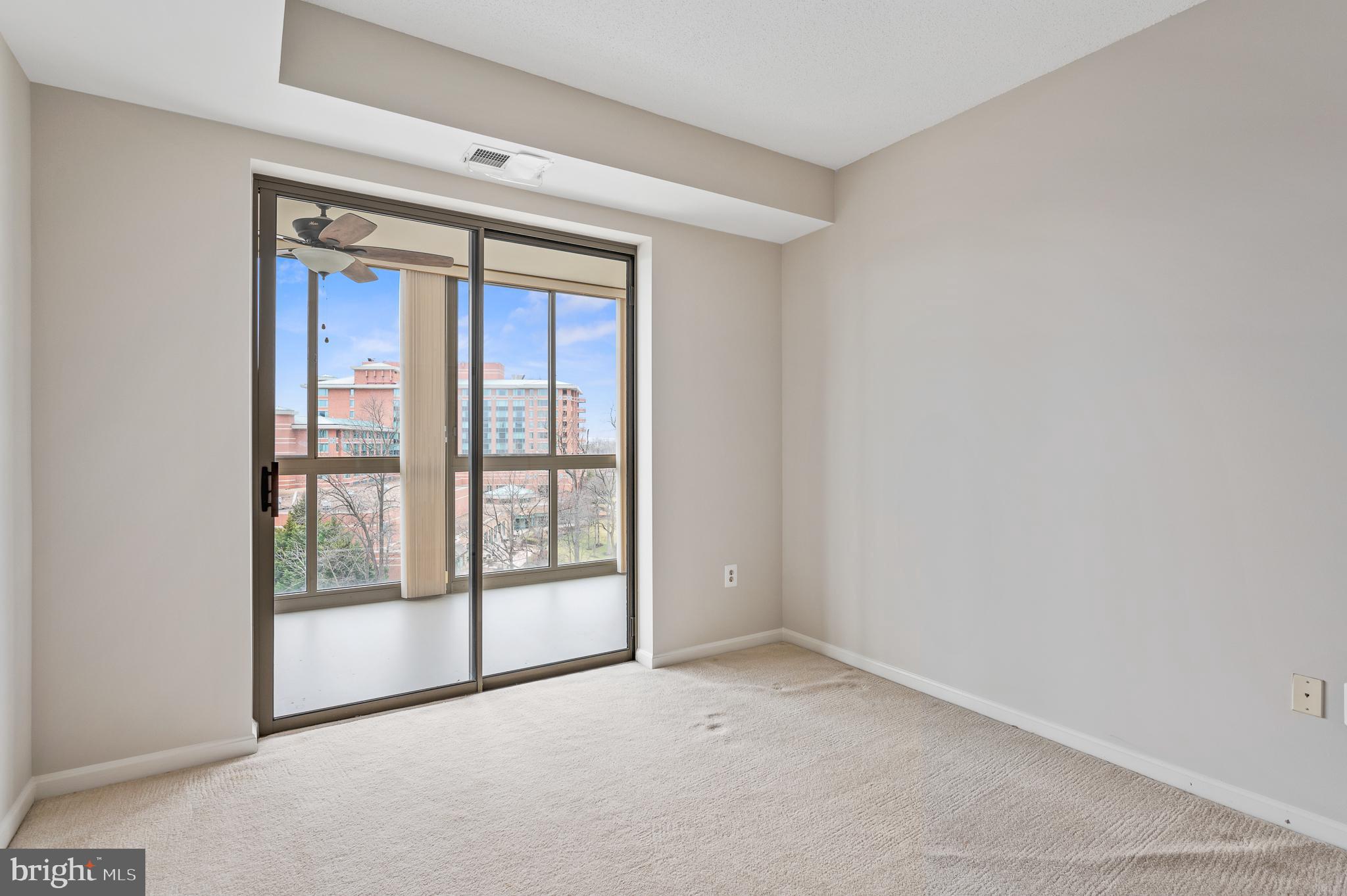 19355 Cypress Ridge Terrace, Unit 821 Leesburg, VA 20176 - Photo 21 of 27 a view of an empty room with a window