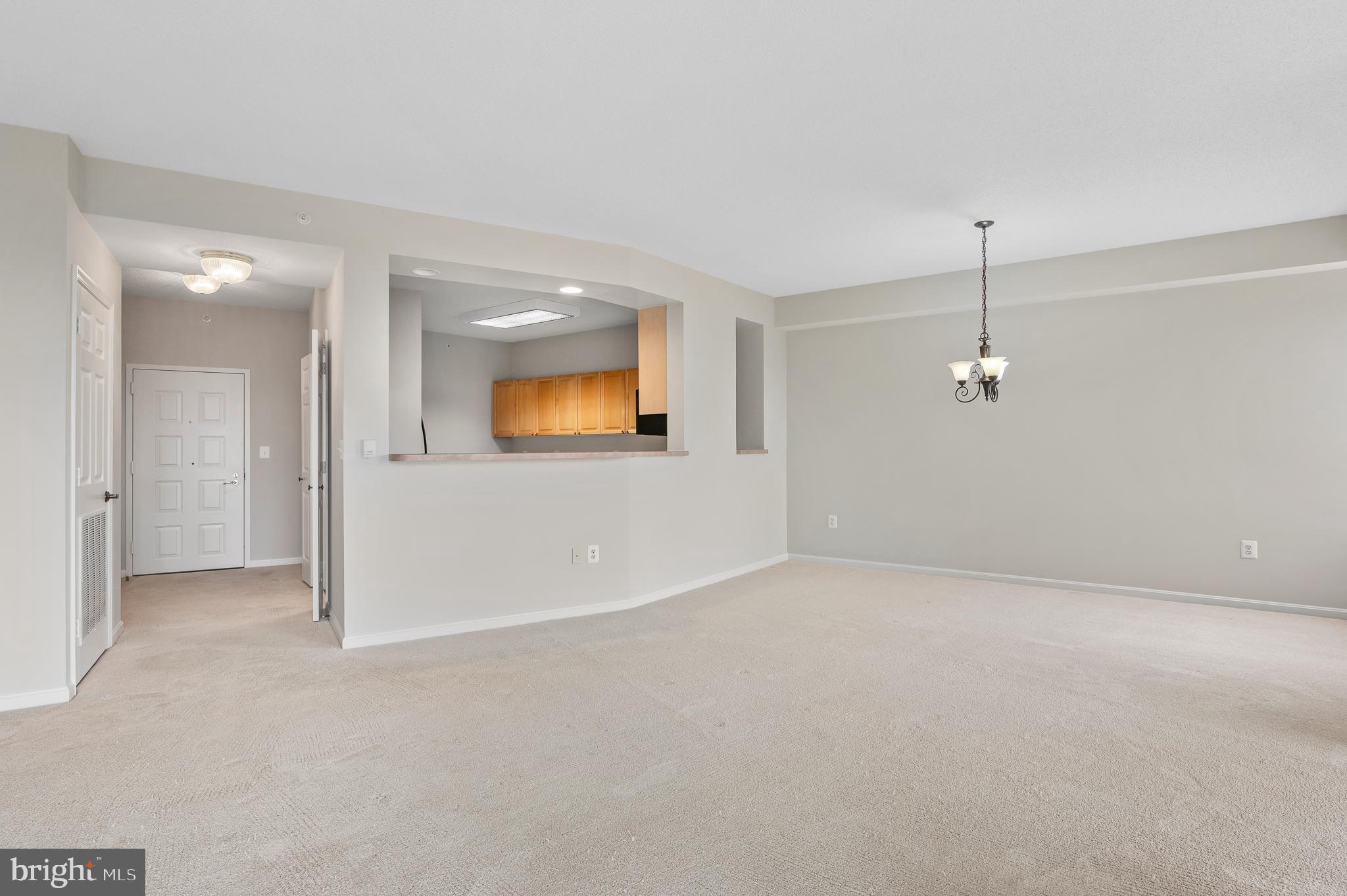 19355 Cypress Ridge Terrace, Unit 821 Leesburg, VA 20176 - Photo 3 of 27 an empty room with a empty space and windows