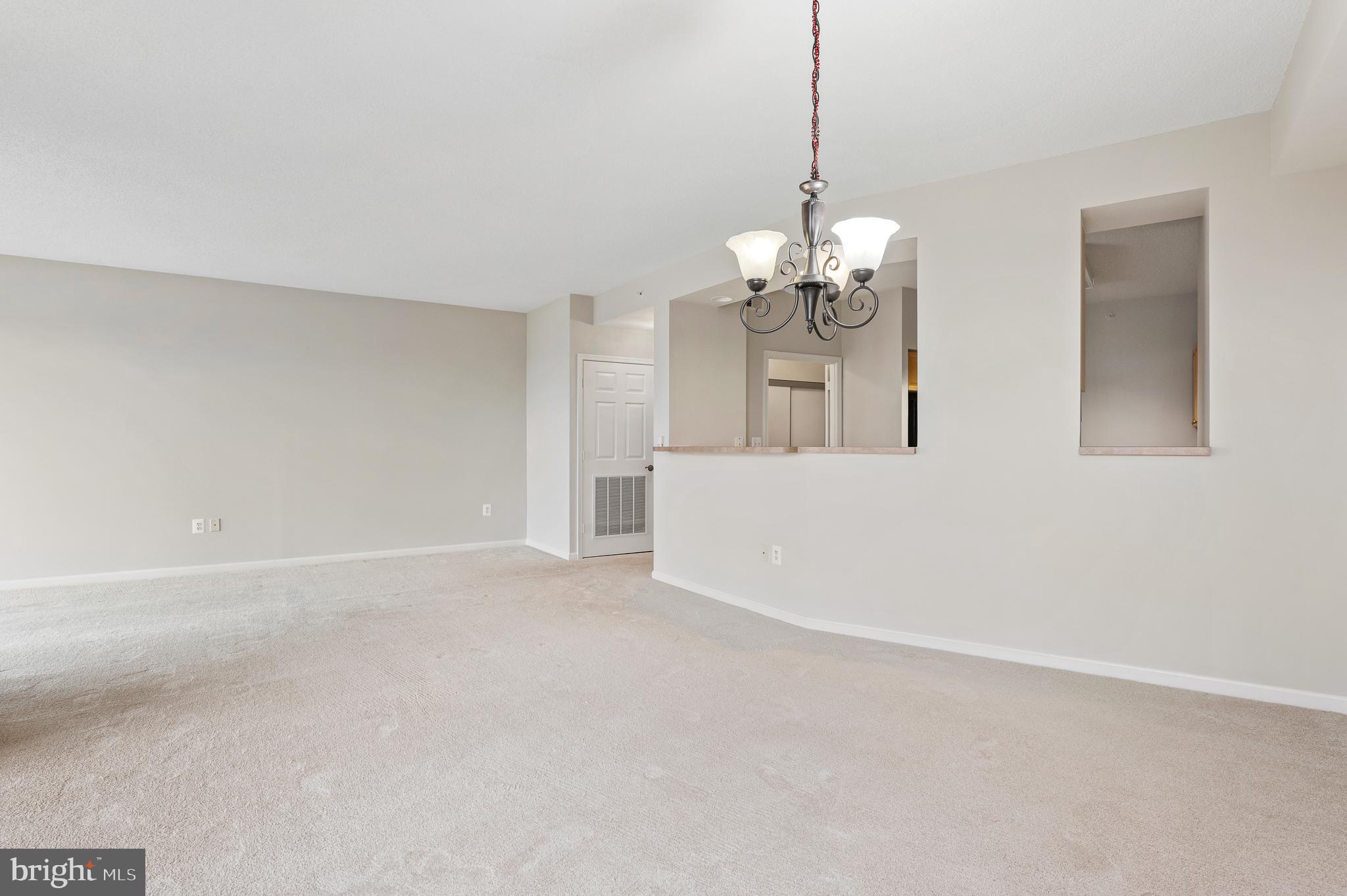 19355 Cypress Ridge Terrace, Unit 821 Leesburg, VA 20176 - Photo 6 of 27 a view of a chandelier in a room