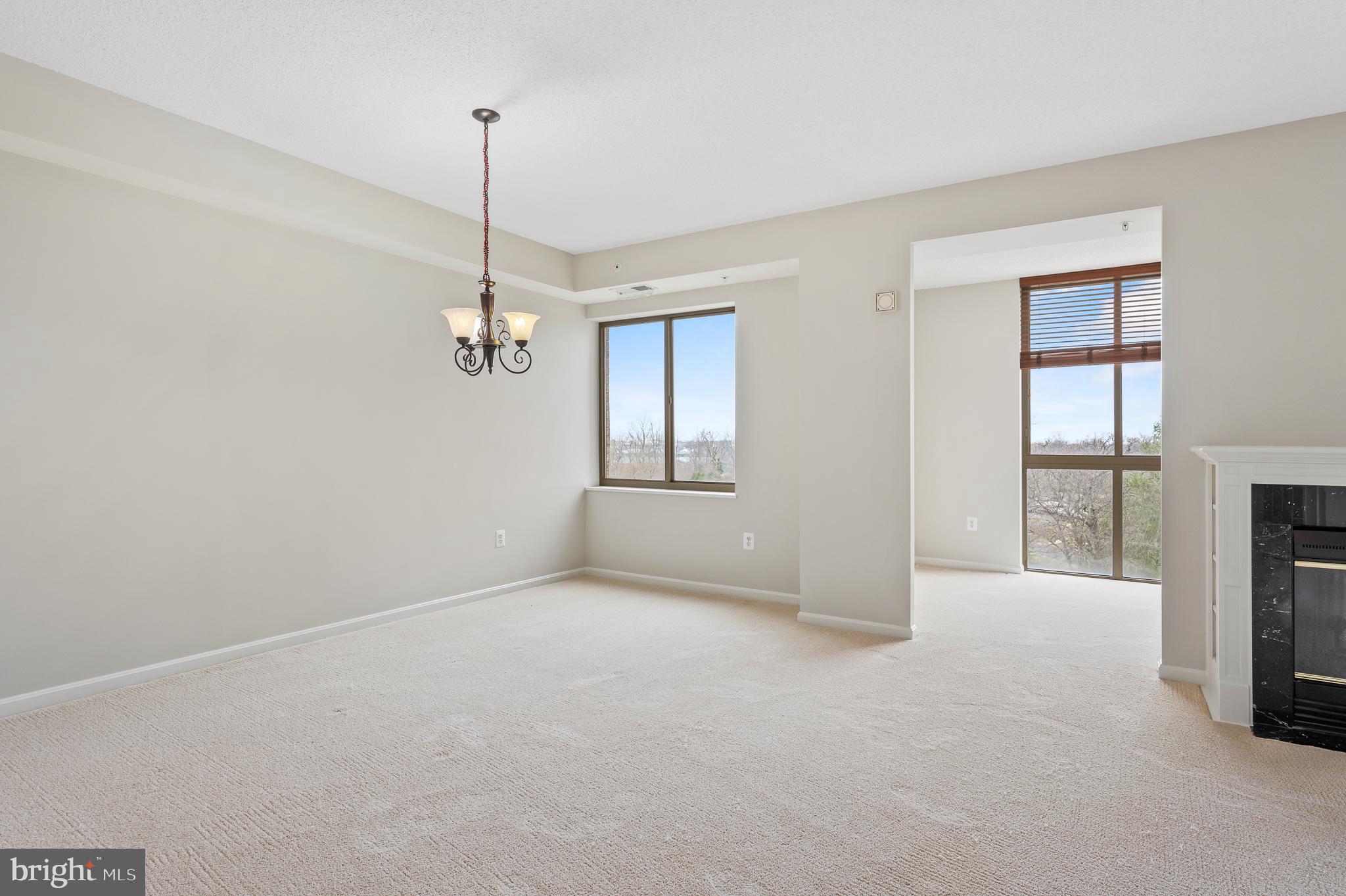 19355 Cypress Ridge Terrace, Unit 821 Leesburg, VA 20176 - Photo 7 of 27 a view of empty room with windows