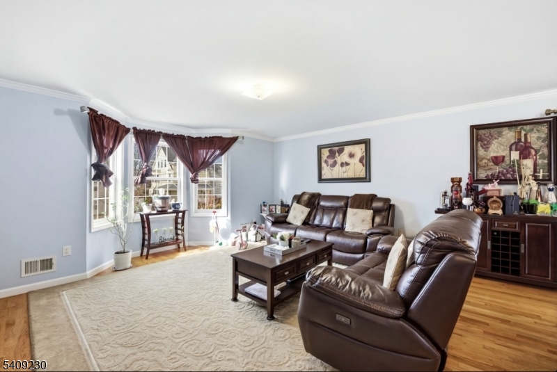 637 Jefferson Avenue Elizabeth, NJ 07201 - Photo 3 of 18 a living room with furniture and a large window