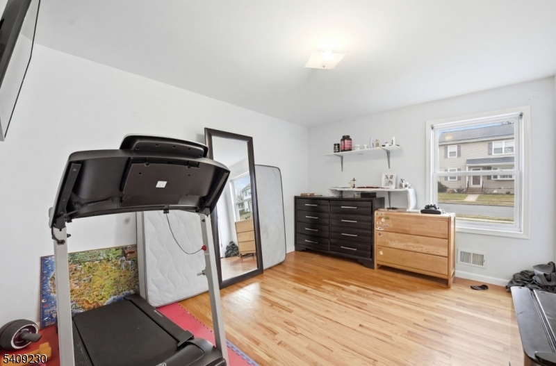 637 Jefferson Avenue Elizabeth, NJ 07201 - Photo 10 of 18 a bedroom with a bed and a window