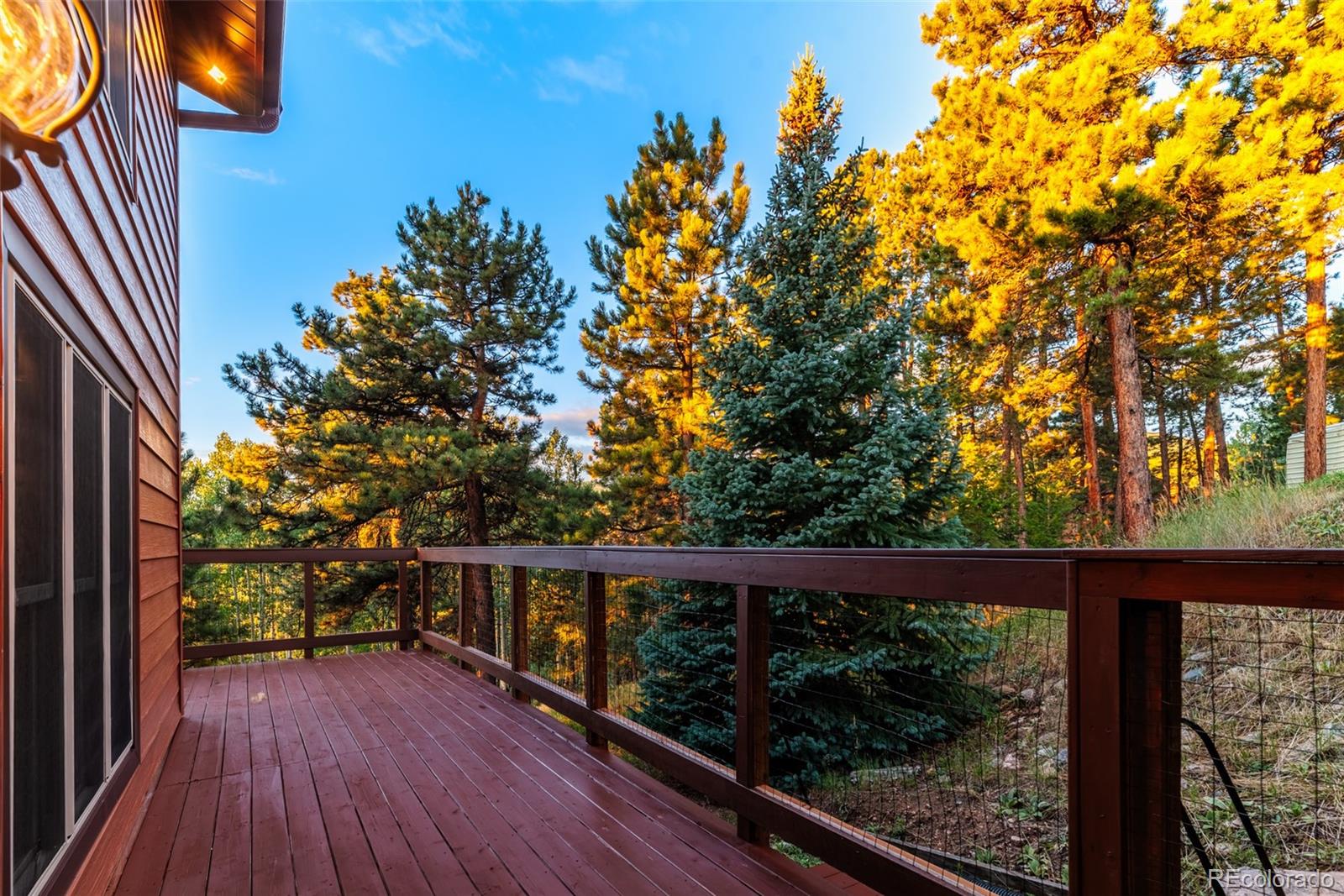 8440 South Warhawk Road Conifer, CO 80433 - Photo 11 of 48 a view of balcony with wooden floor