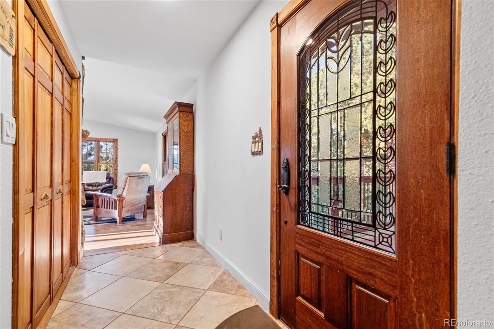 8440 South Warhawk Road Conifer, CO 80433 - Photo 12 of 48 a view of an entryway with a door