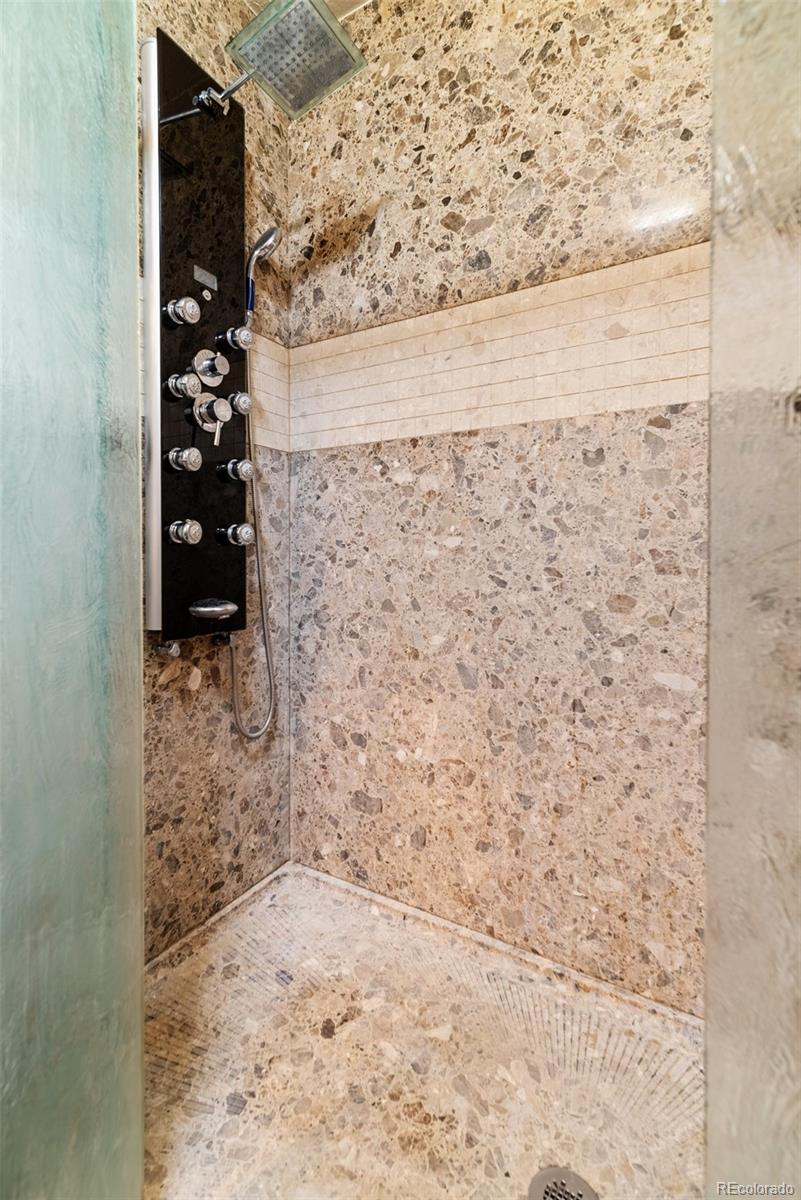 8440 South Warhawk Road Conifer, CO 80433 - Photo 22 of 48 a bathroom with a shower