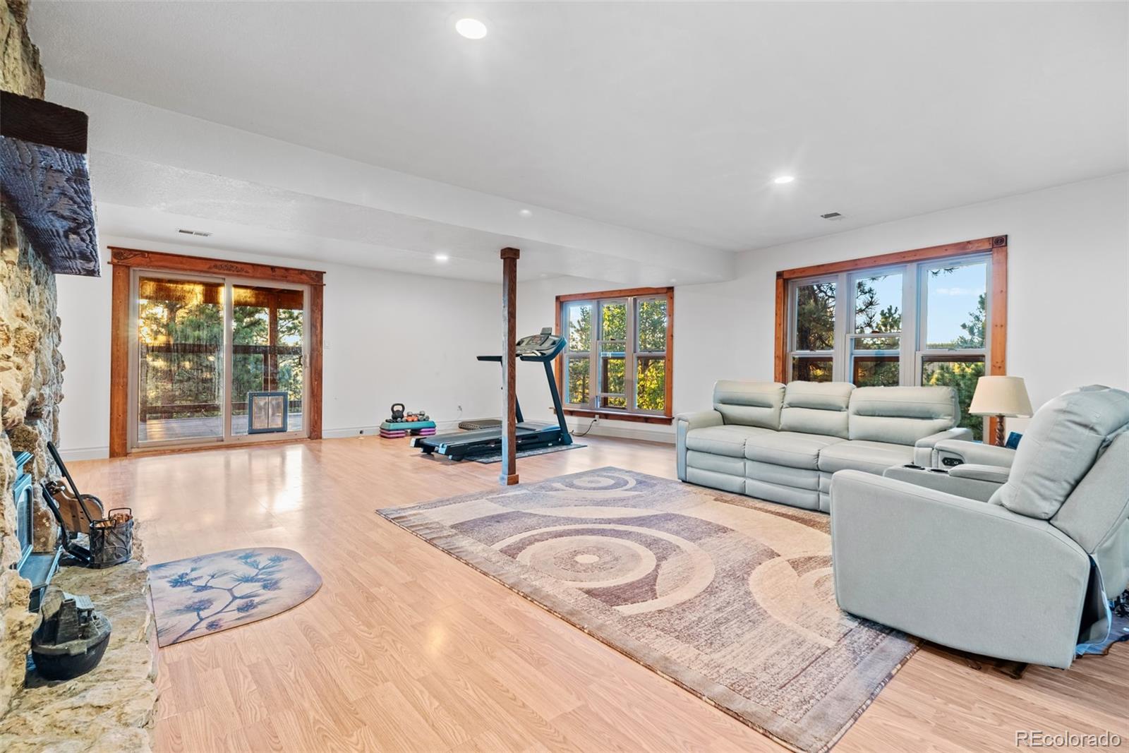 8440 South Warhawk Road Conifer, CO 80433 - Photo 28 of 48 a living room with furniture and a large window