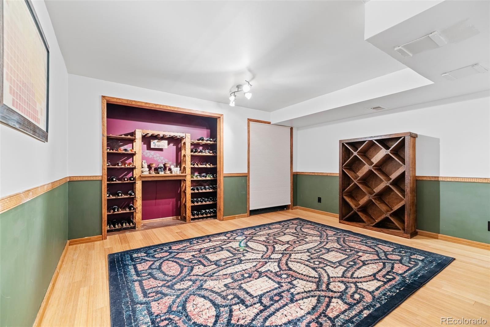 8440 South Warhawk Road Conifer, CO 80433 - Photo 34 of 48 a view of an empty room with window and wooden floor