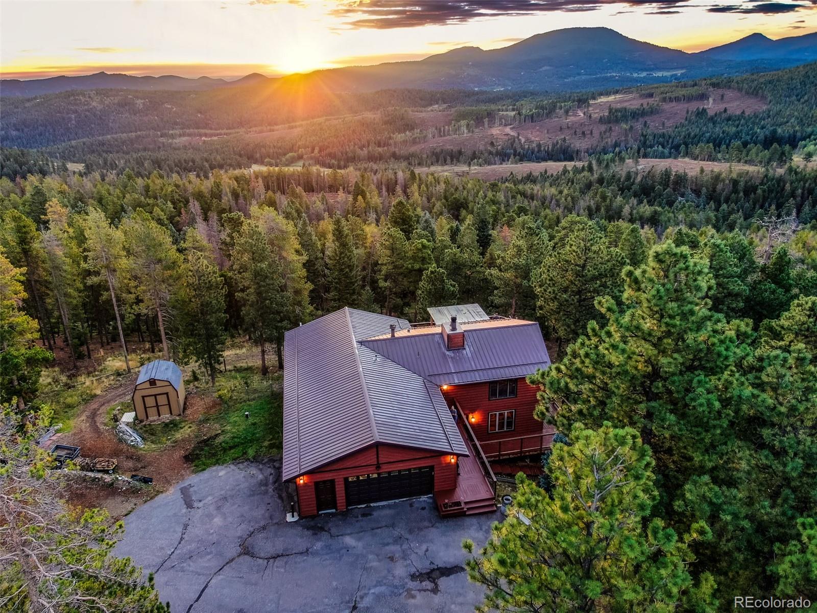 8440 South Warhawk Road Conifer, CO 80433 - Photo 5 of 48 an aerial view of a deck and mountain view in back