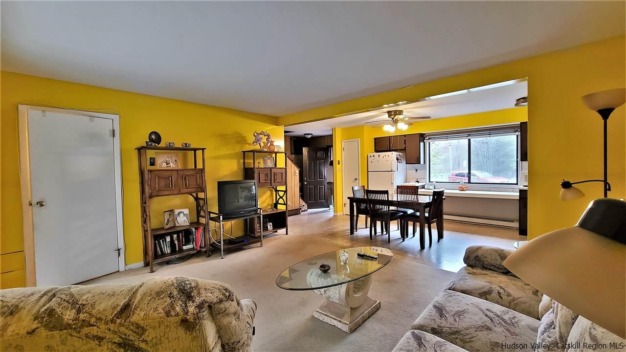 52 Medallion Road Kiamesha Lake, NY 12751 - Photo 11 of 31 a living room with furniture and a large window