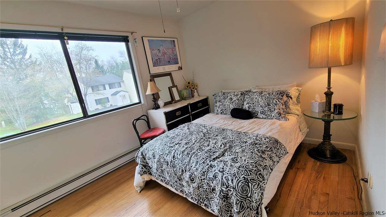 52 Medallion Road Kiamesha Lake, NY 12751 - Photo 16 of 31 a bedroom with a bed and wooden floor