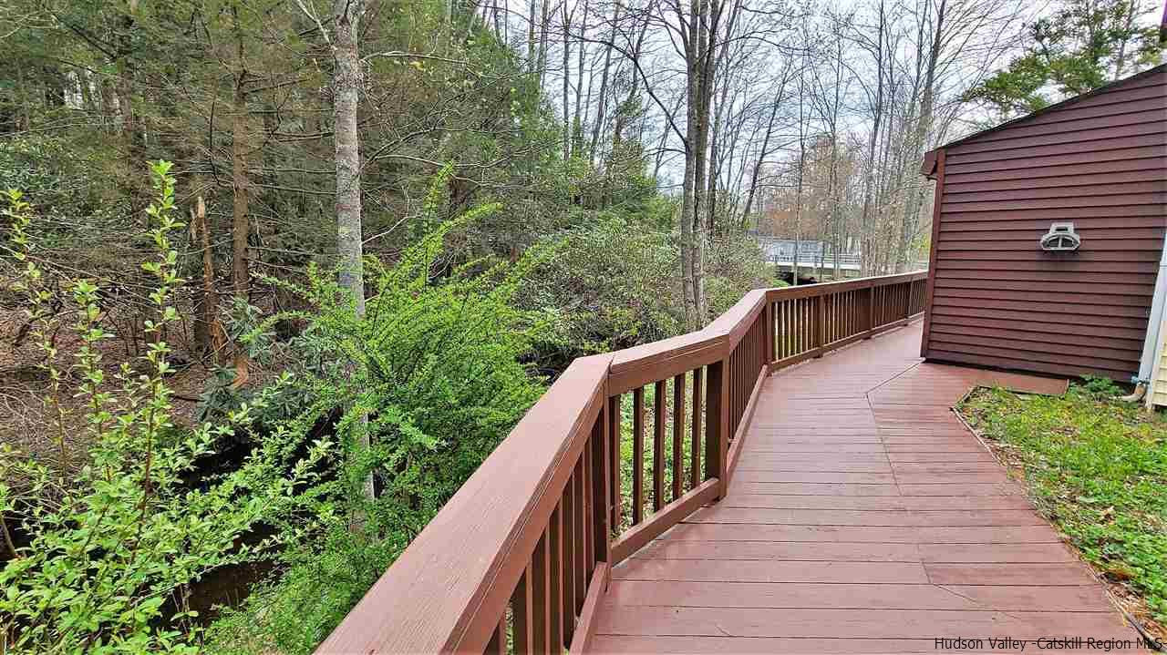 52 Medallion Road Kiamesha Lake, NY 12751 - Photo 25 of 31 a balcony with trees in front of it
