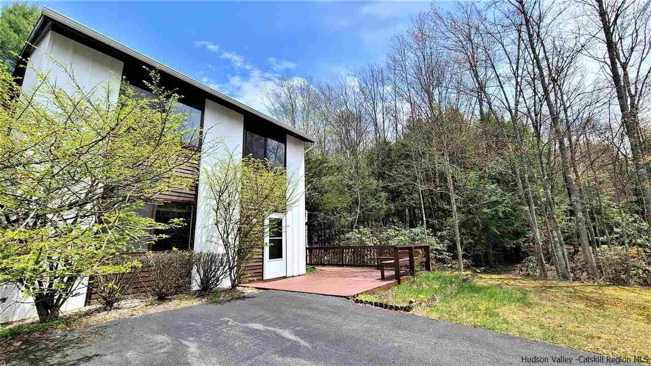 52 Medallion Road Kiamesha Lake, NY 12751 - Photo 3 of 31 a view of swimming pool with lawn chairs and plants