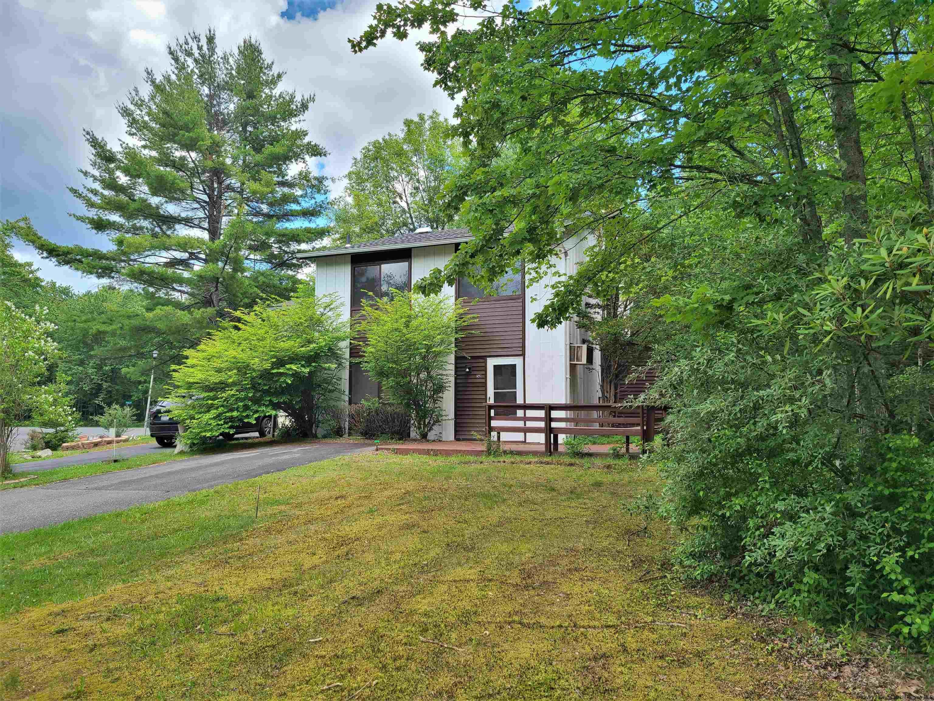 52 Medallion Road Kiamesha Lake, NY 12751 - Photo 31 of 31 a backyard of a house with table and chairs and wooden fence