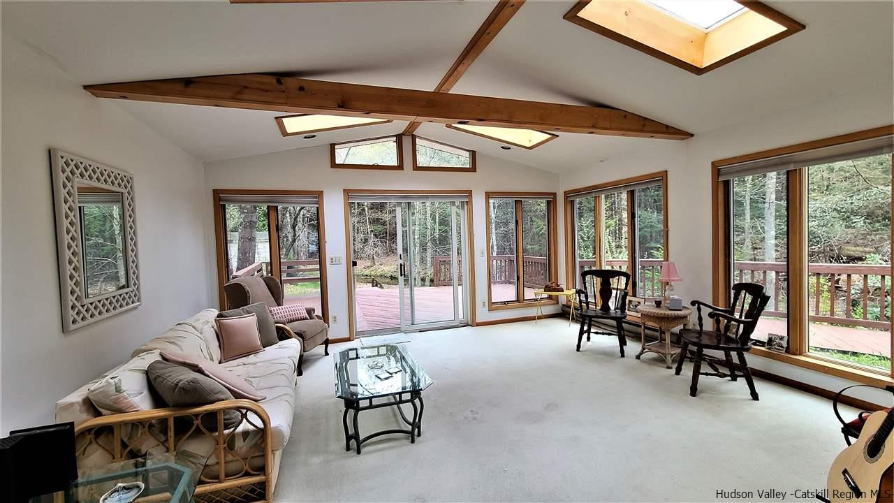 52 Medallion Road Kiamesha Lake, NY 12751 - Photo 4 of 31 a living room with furniture and floor to ceiling windows