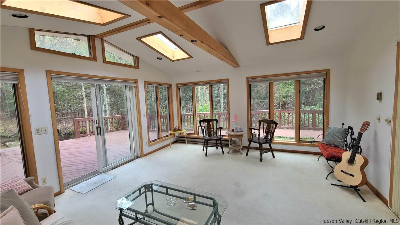 52 Medallion Road Kiamesha Lake, NY 12751 - Photo 6 of 31 a living room with furniture gym equipment and a large window
