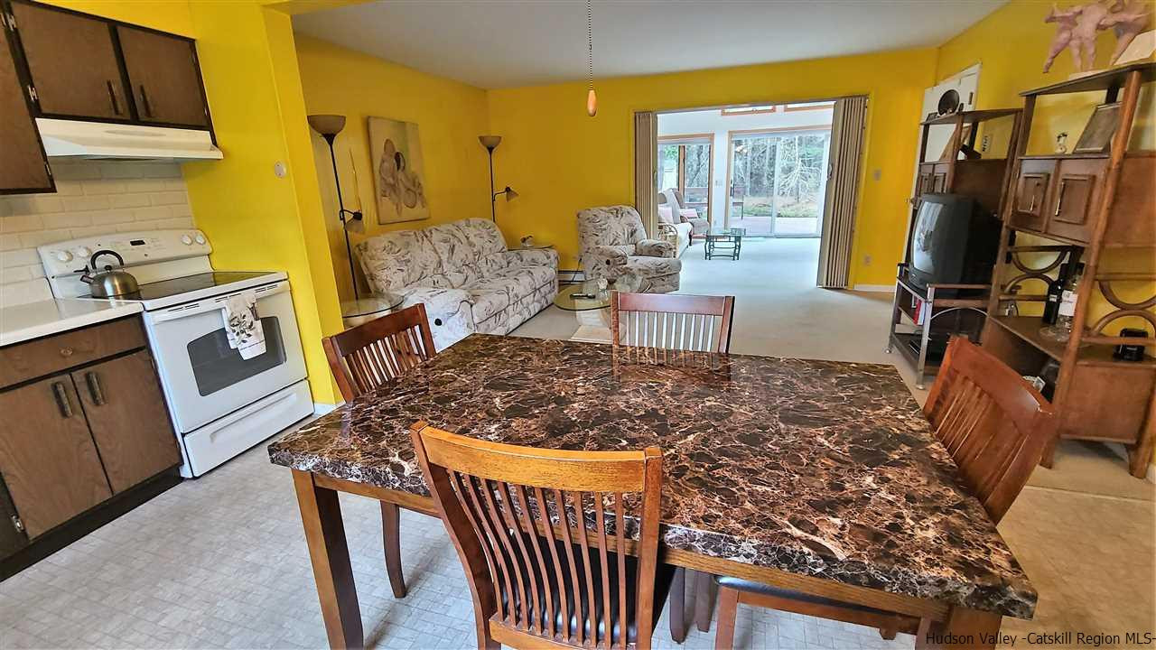 52 Medallion Road Kiamesha Lake, NY 12751 - Photo 9 of 31 a living room with a couch and a stove top oven