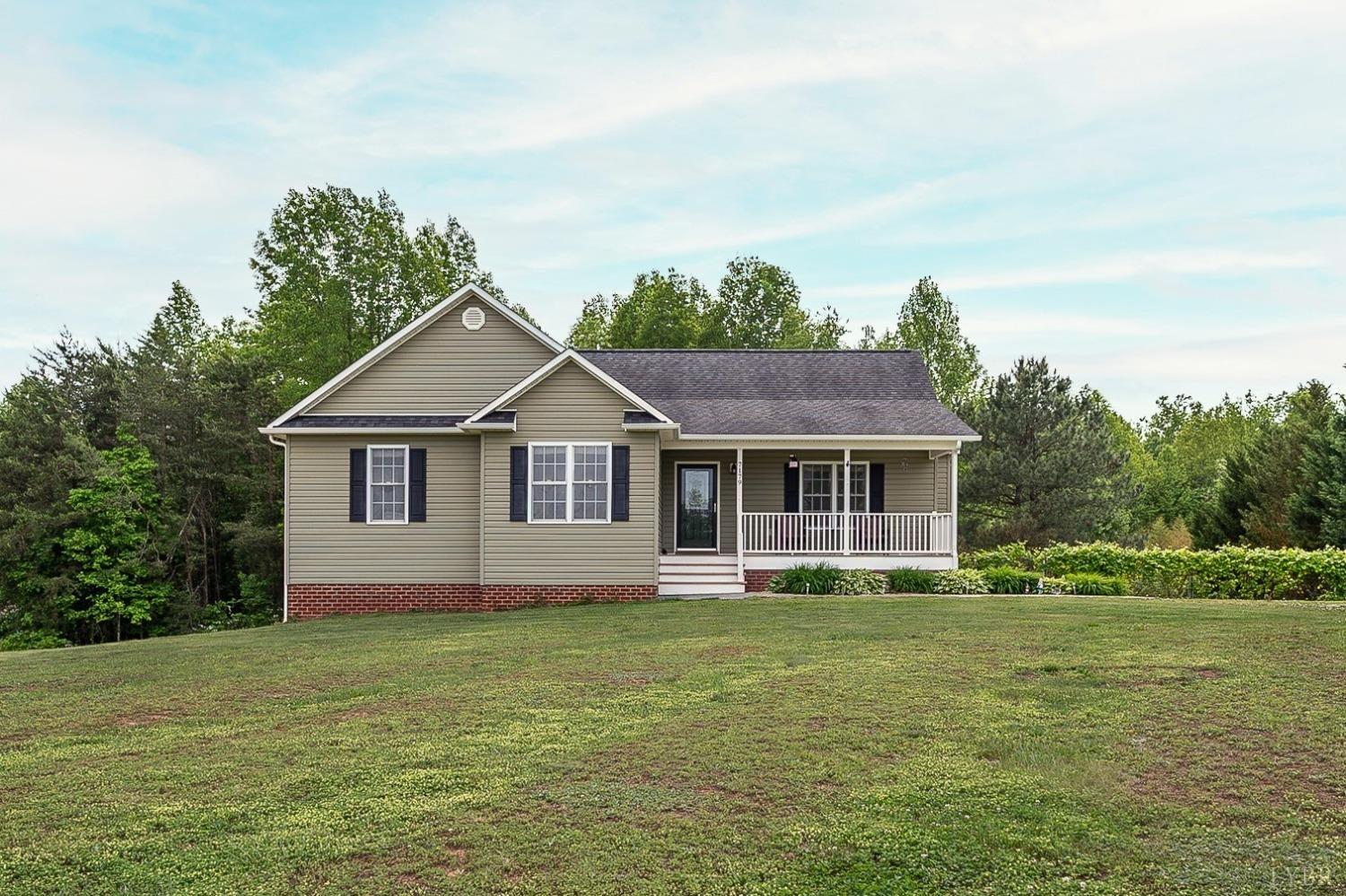 7179 Stage Road Concord, VA 24538 - Photo 1 of 52 a front view of a house with garden