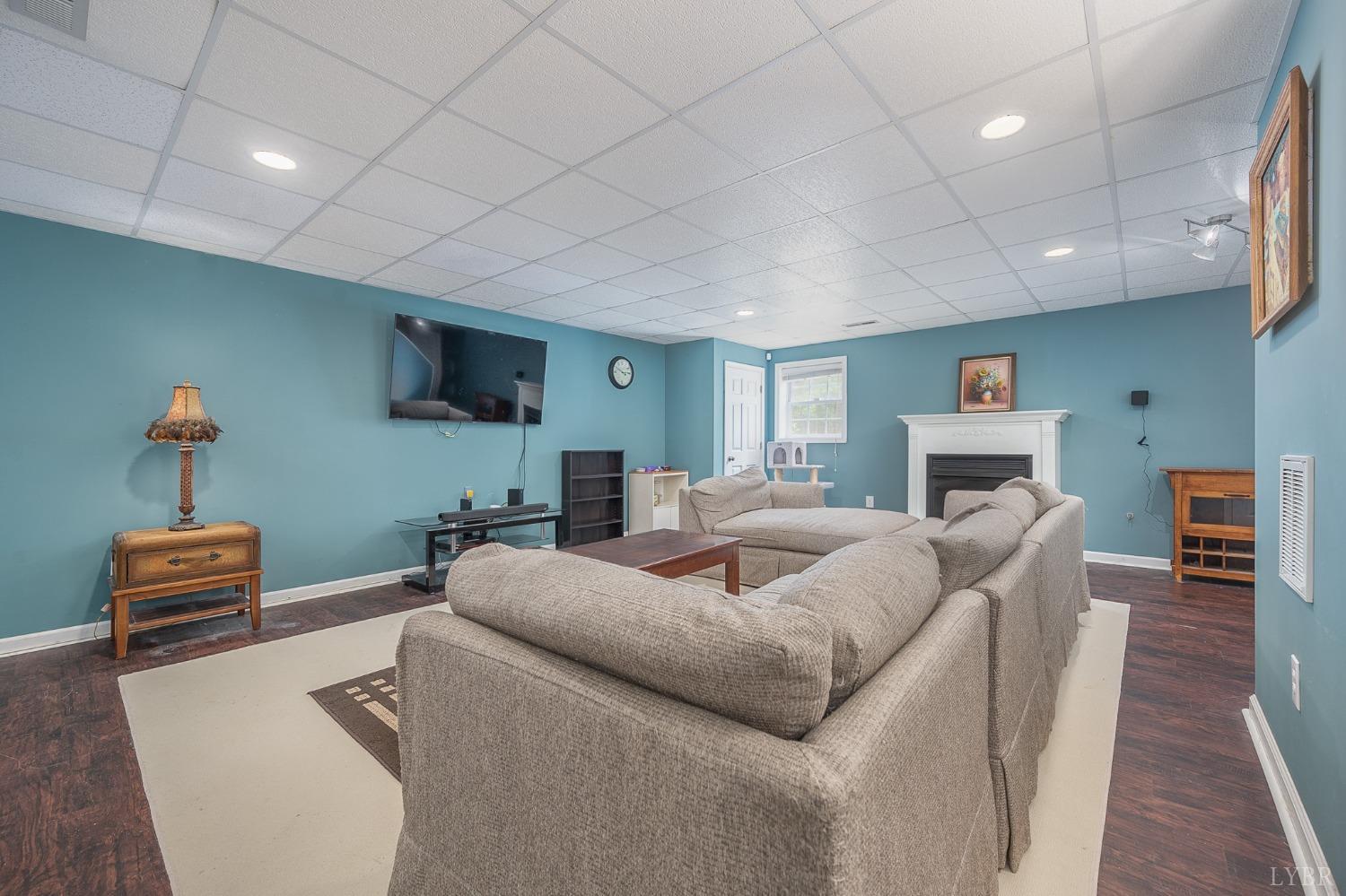 7179 Stage Road Concord, VA 24538 - Photo 24 of 52 a living room with furniture and a flat screen tv