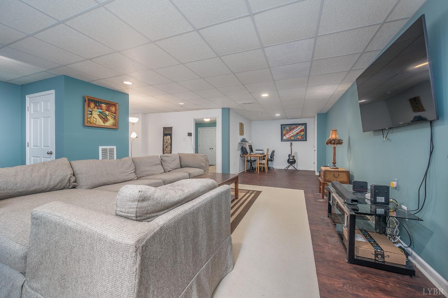 7179 Stage Road Concord, VA 24538 - Photo 25 of 52 a living room with furniture and a flat screen tv