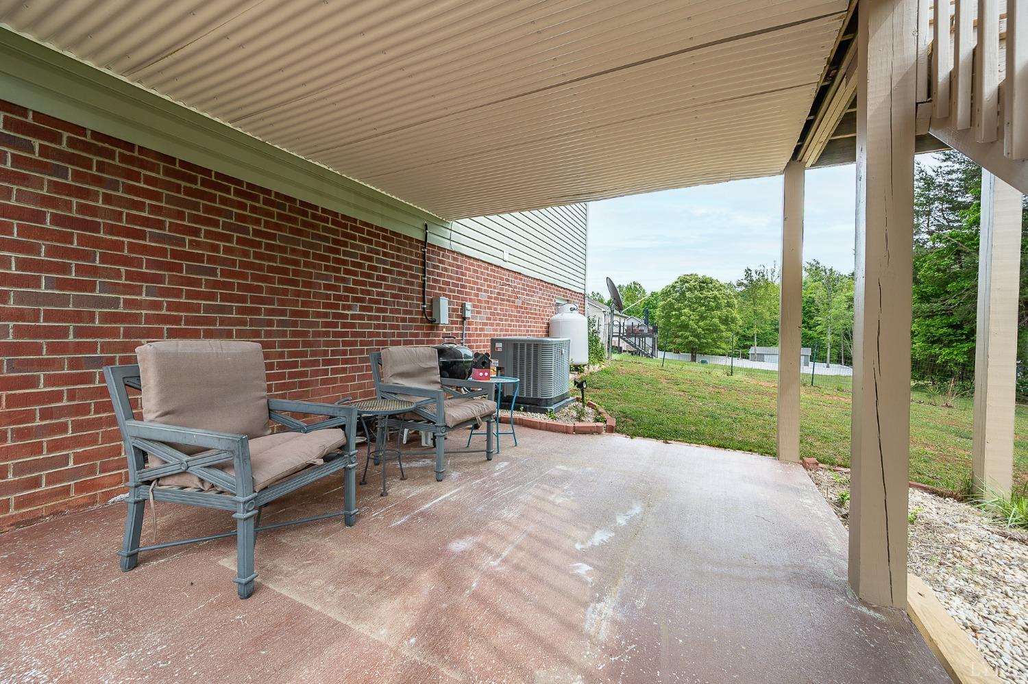 7179 Stage Road Concord, VA 24538 - Photo 36 of 52 a view of a patio with table and chairs and potted plants