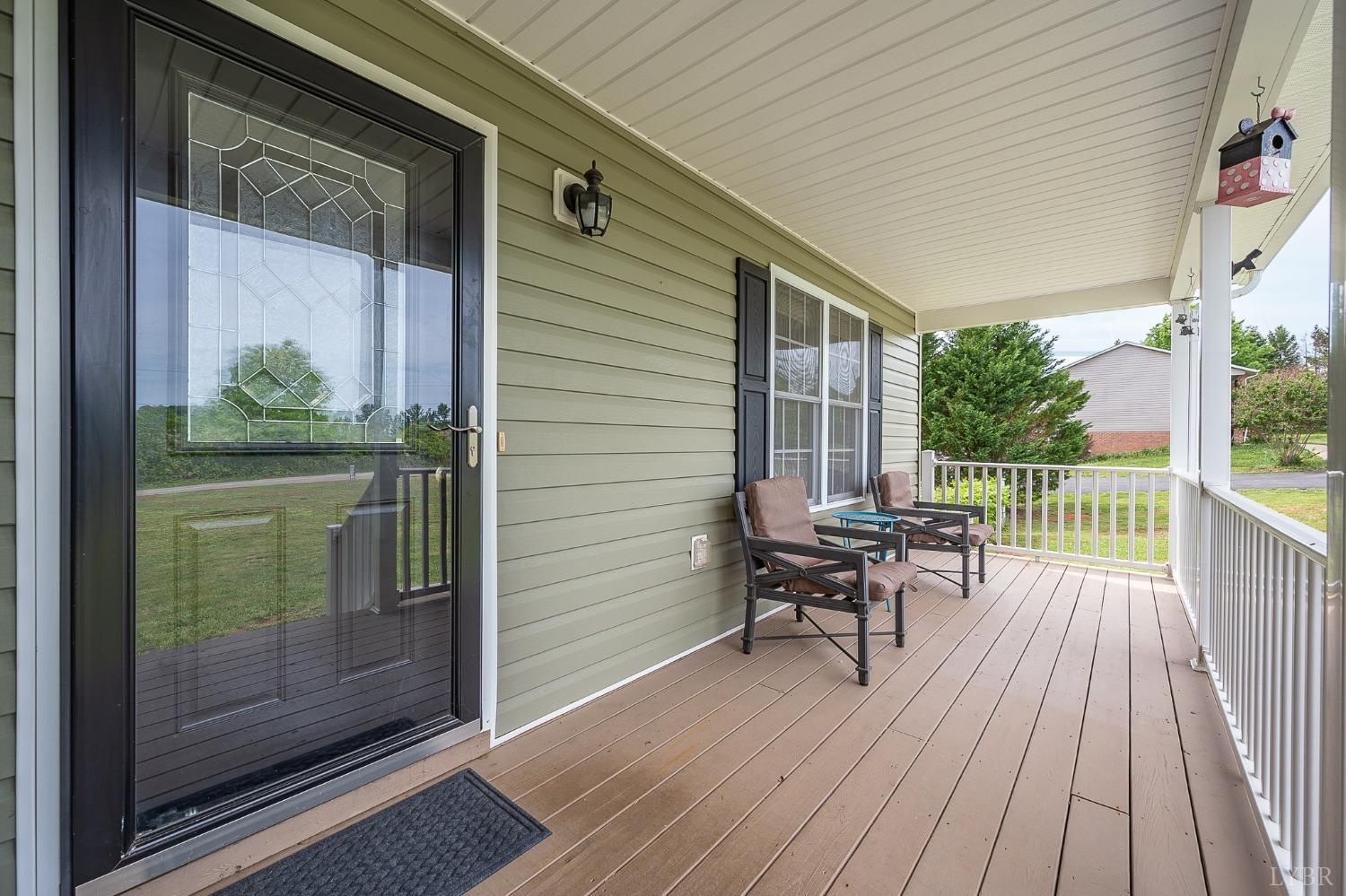 7179 Stage Road Concord, VA 24538 - Photo 4 of 52 a balcony with chairs and wooden floor